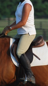 Photo 2. The rider’s thigh is on, not gripping, and she is balanced over her feet. She can change her diagonal in the air. 